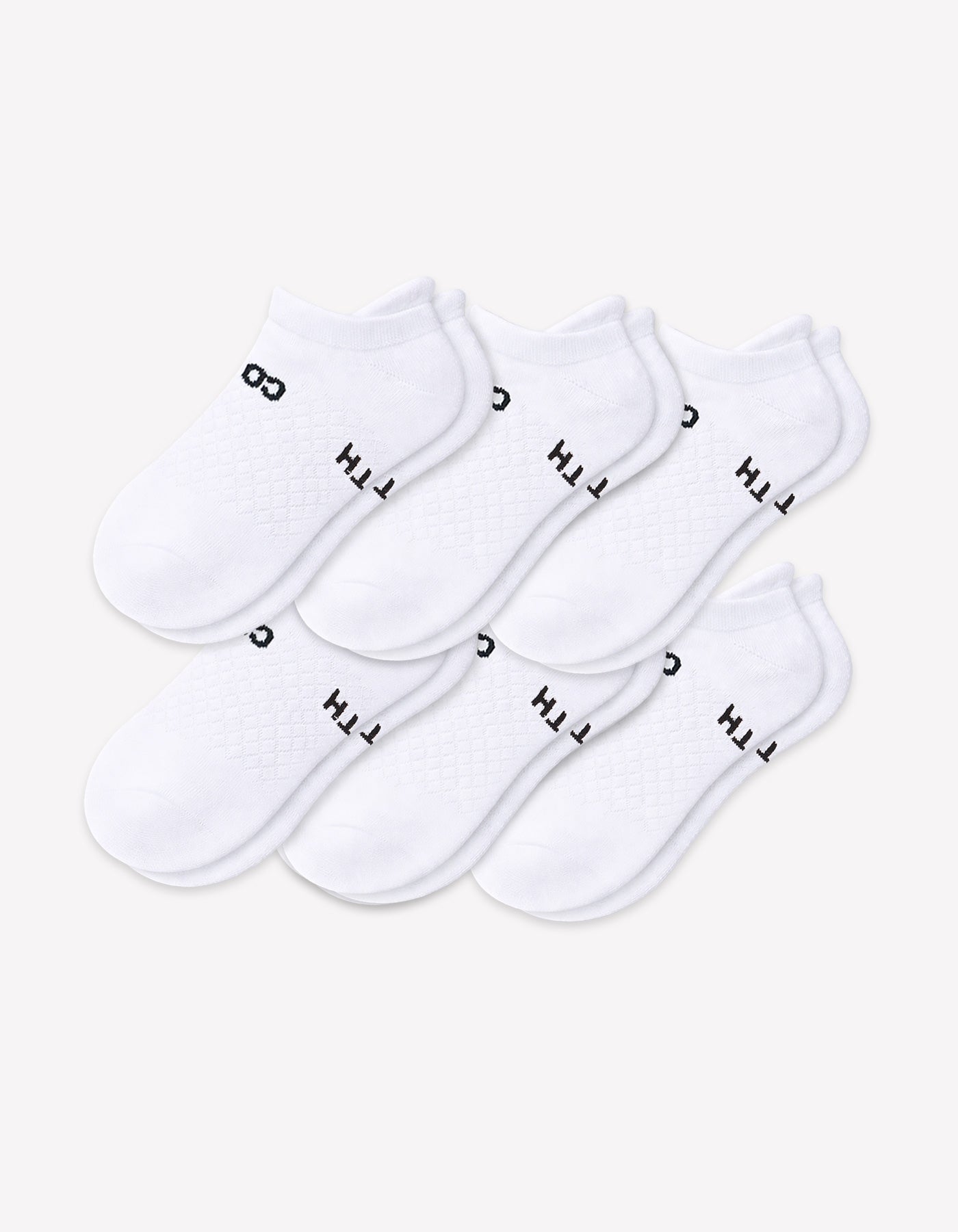 Six pairs from the Cozy Earth Men's Essential Ankle Sock 6-Pack are neatly arranged in two rows on a plain light background, each featuring black text near the cuff.