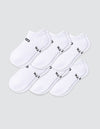Six pairs of Cozy Earth Women's Essential Ankle Socks in white, featuring black text near the elastic opening, are arranged in two overlapping rows on a light gray background.|Color:White