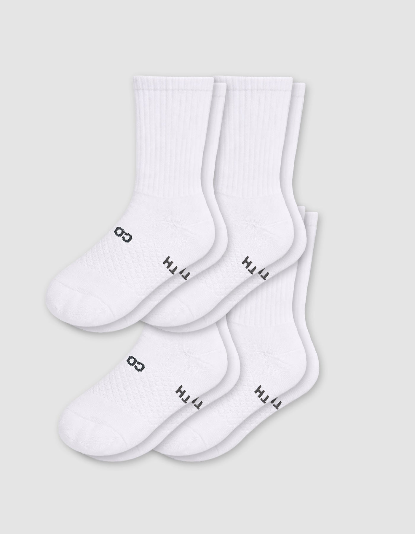 Cozy Earth Men's Essential Calf Sock 4-Pack in white, featuring black text near the toes, displayed on a light gray background.