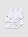 Six pairs of Cozy Earth Men's Essential Calf Socks in white are arranged in two rows on a light gray background, each featuring small black text and a symbol near the toes and ribbed cuffs.|Color:White
