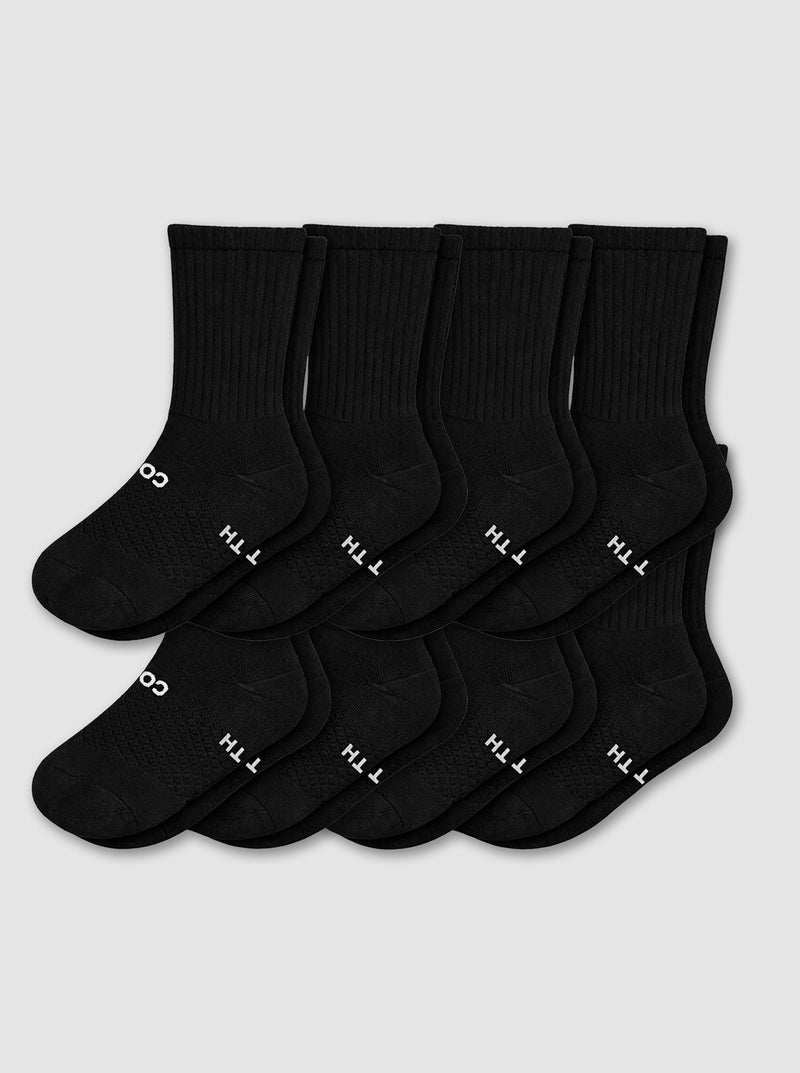 Eight pairs from the Cozy Earth Men's Essential Calf Sock 8-Pack in black are displayed in two neat overlapping rows on a light gray background, each featuring small white text and symbols near the toes.