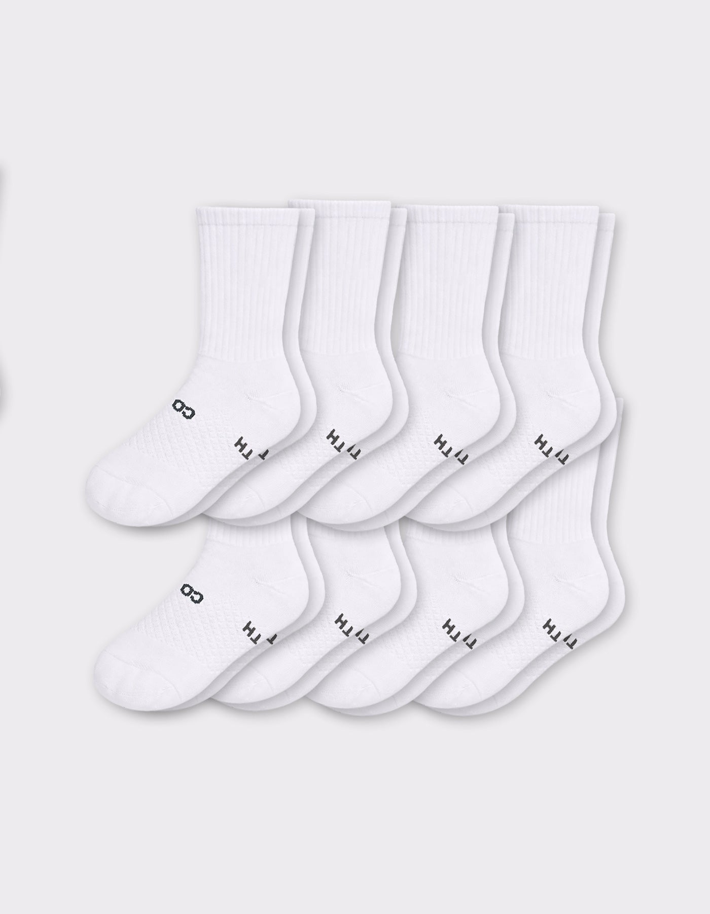 Eight pairs from the Cozy Earth Men's Essential Calf Sock 8-Pack are displayed in two neat overlapping rows on a light gray background, each featuring small black text and symbols near the toes.