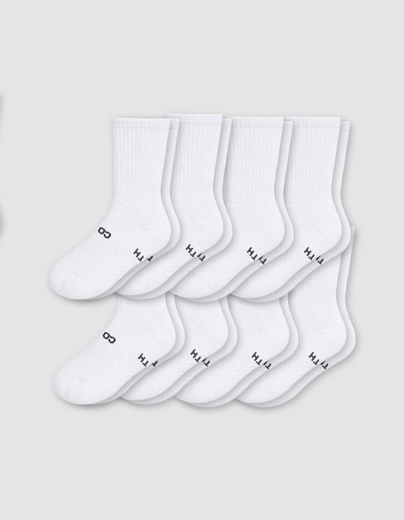 Eight pairs from the Cozy Earth Men's Essential Calf Sock 8-Pack are displayed in two neat overlapping rows on a light gray background, each featuring small black text and symbols near the toes.