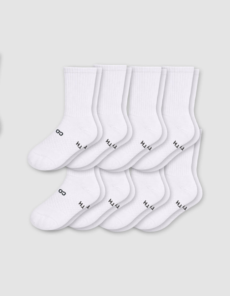 Eight pairs from the Cozy Earth Men's Essential Calf Sock 8-Pack are displayed in two neat overlapping rows on a light gray background, each featuring small black text and symbols near the toes.