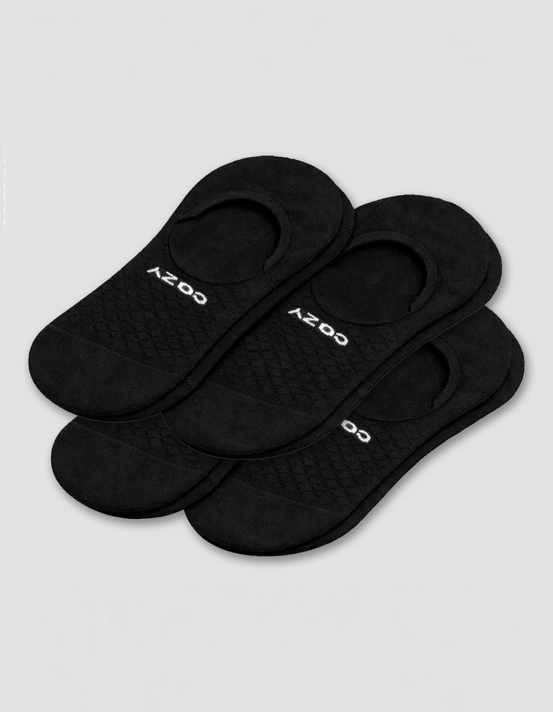 A 4-pack of black Men's Essential No-Show Socks by Cozy Earth, each pair featuring "COZY" in white, displayed on a plain white background.