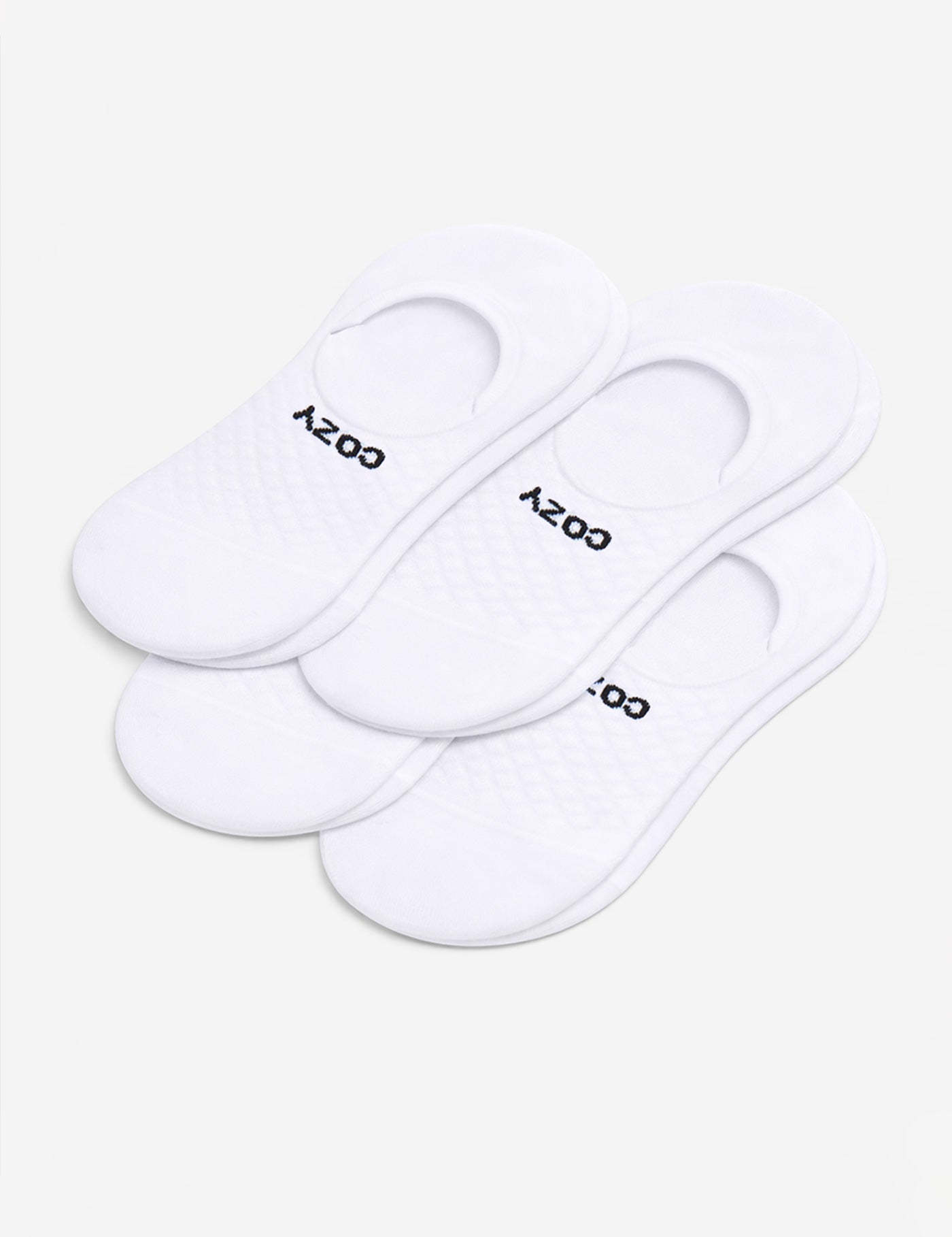 A 4-pack of white Men's Essential No-Show Socks by Cozy Earth, each pair featuring "COZY" in black, displayed on a plain white background.|Color:White