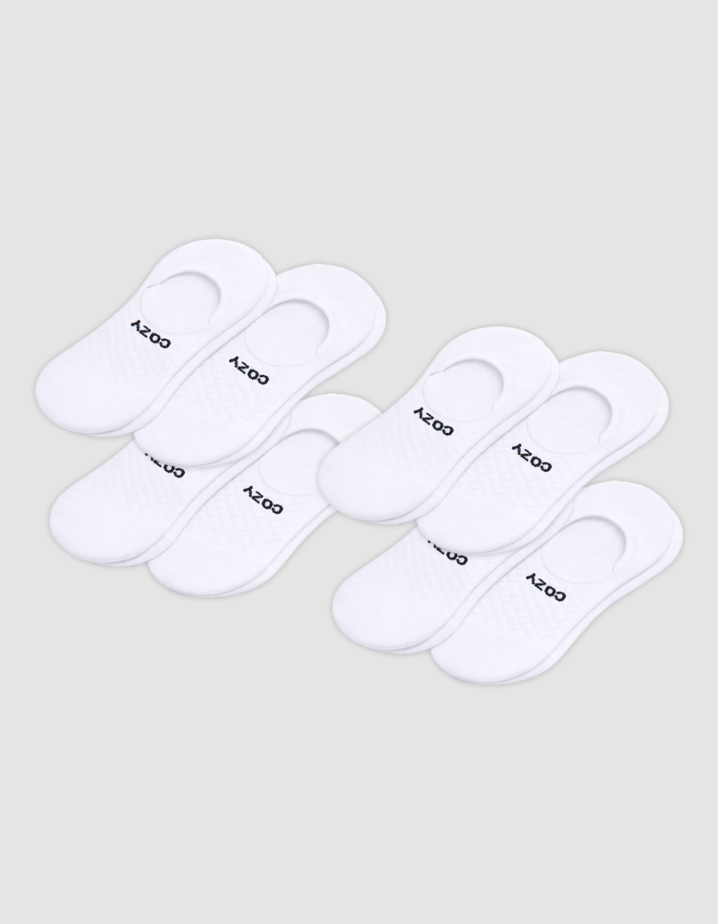 Eight pairs of Cozy Earth Men's Essential No-Show Socks are displayed in two rows on a plain background, featuring a low-cut design with the brand name near the heel.|Color:White