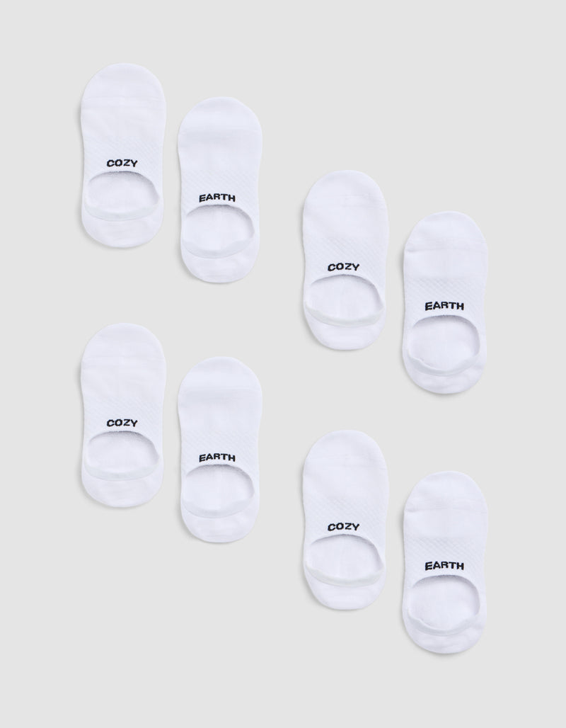 Eight pairs of white socks from the Cozy Earth Essential No-Show Sock 4-Pack are arranged on a light grey background, each sock featuring "COZY" or "EARTH" in black text at the toes.