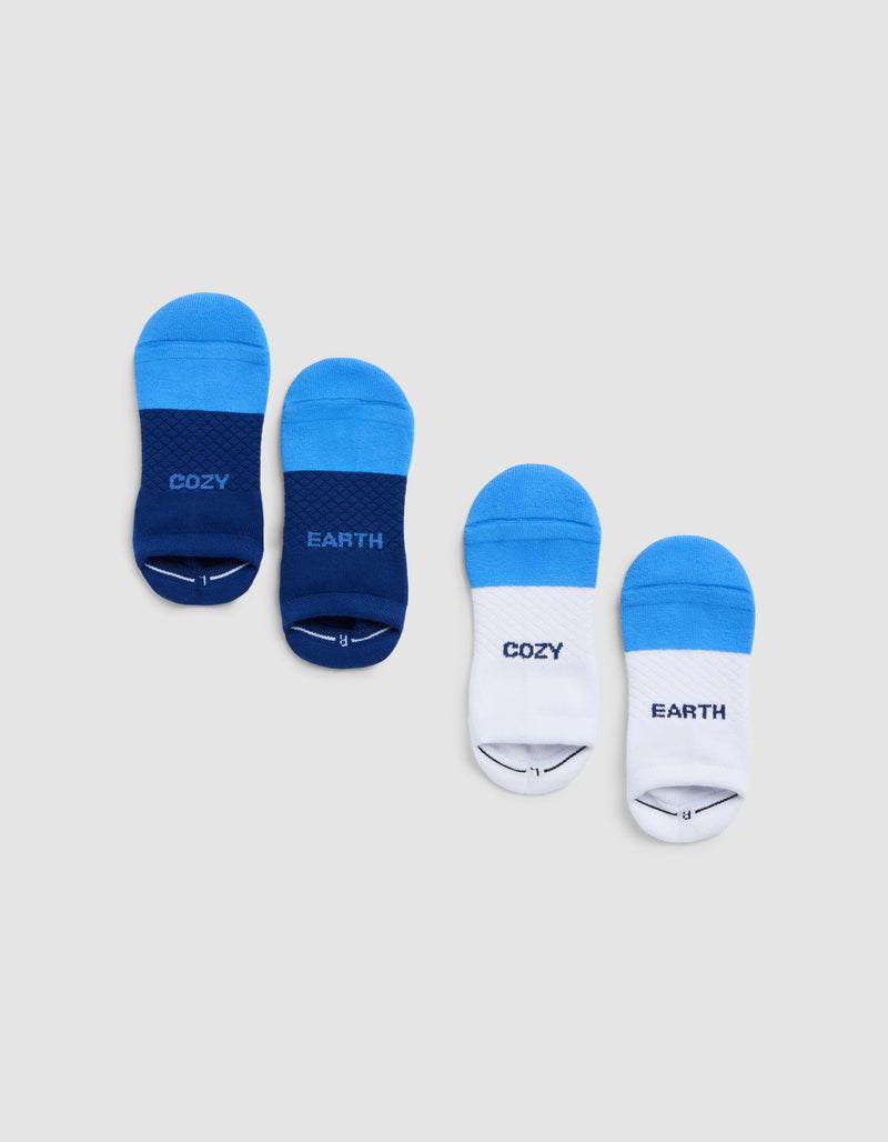Two pairs of Cozy Earth Essential Ankle Socks—one dark blue, one white with light blue—each with "COZY" on the left and "EARTH" on the right, are displayed on a light gray background.
