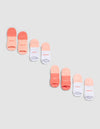 The Cozy Earth Essential Ankle Sock 4-Pack features socks in coral, peach, and white, each with "COZY" or "EARTH" near the toes, shown diagonally on a light gray background. |Color:Cantaloupe