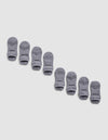 Four pairs of gray Essential Ankle Socks from Cozy Earth are arranged diagonally on a light gray background, each featuring "COZY EARTH" printed in black near the toes.|Color:Stone