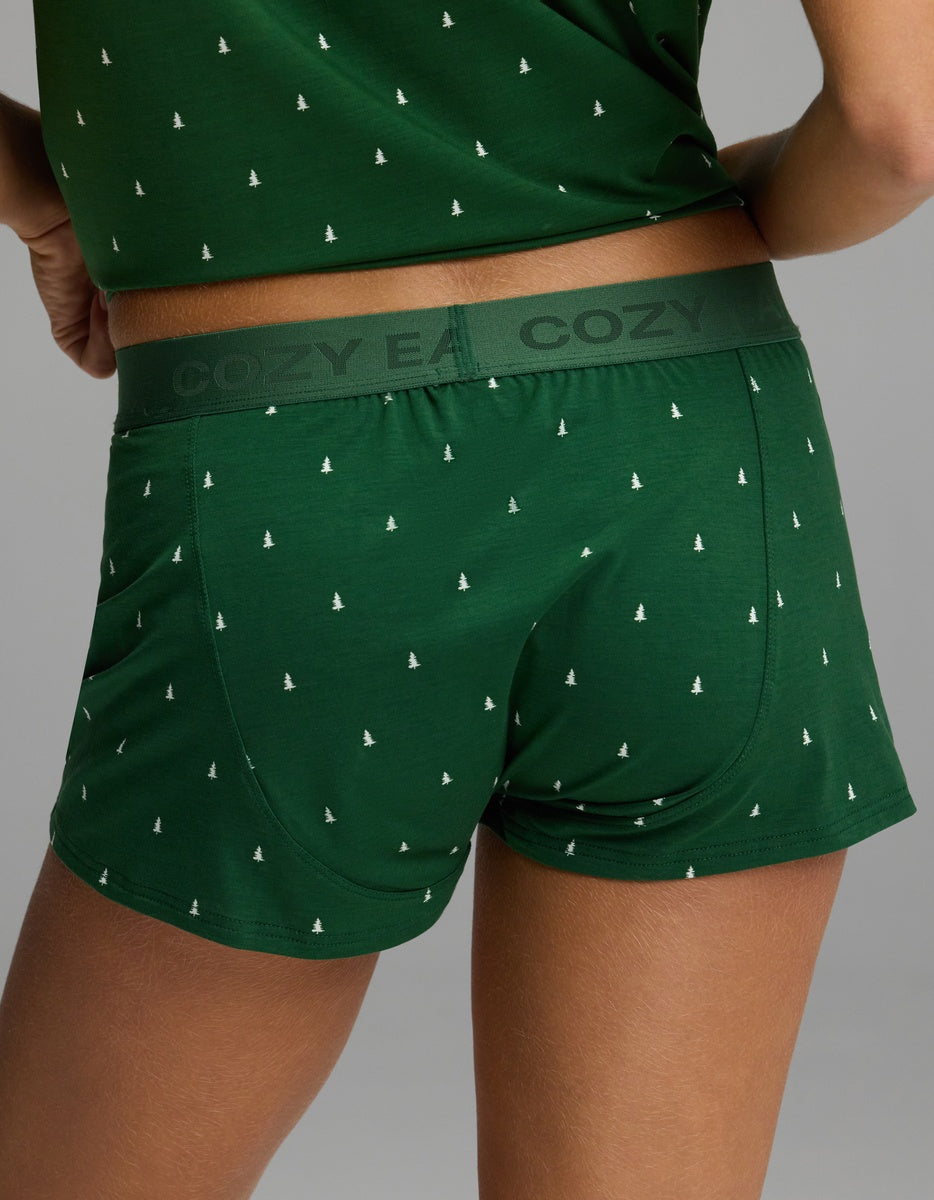Back view of Cozy Earth Women’s First Layer Pajama Boxer Short in green with a white pine tree pattern and an elastic waistband.
