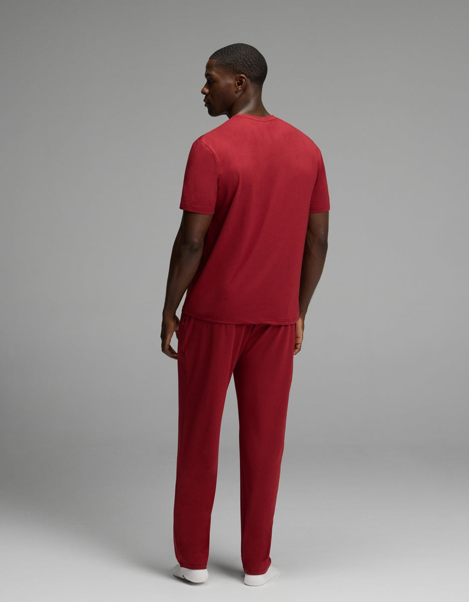 A man seen from behind wearing a maroon Men’s First Layer Pajama Short Sleeve Tee & Pant Set.