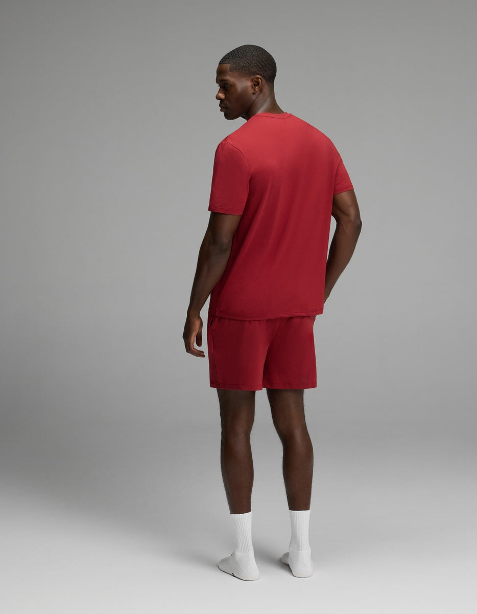 A man seen from the back wearing a red Men’s First Layer Pajama Short Sleeve Tee & Short Set.