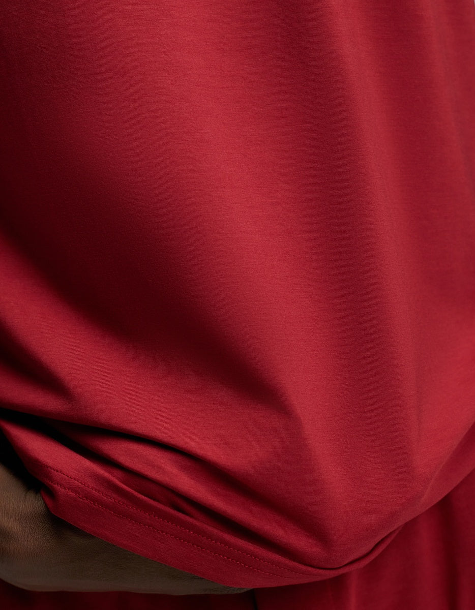 Close-up of a deep red short-sleeved Cozy Earth Men’s First Layer Pajama Short Sleeve Tee.