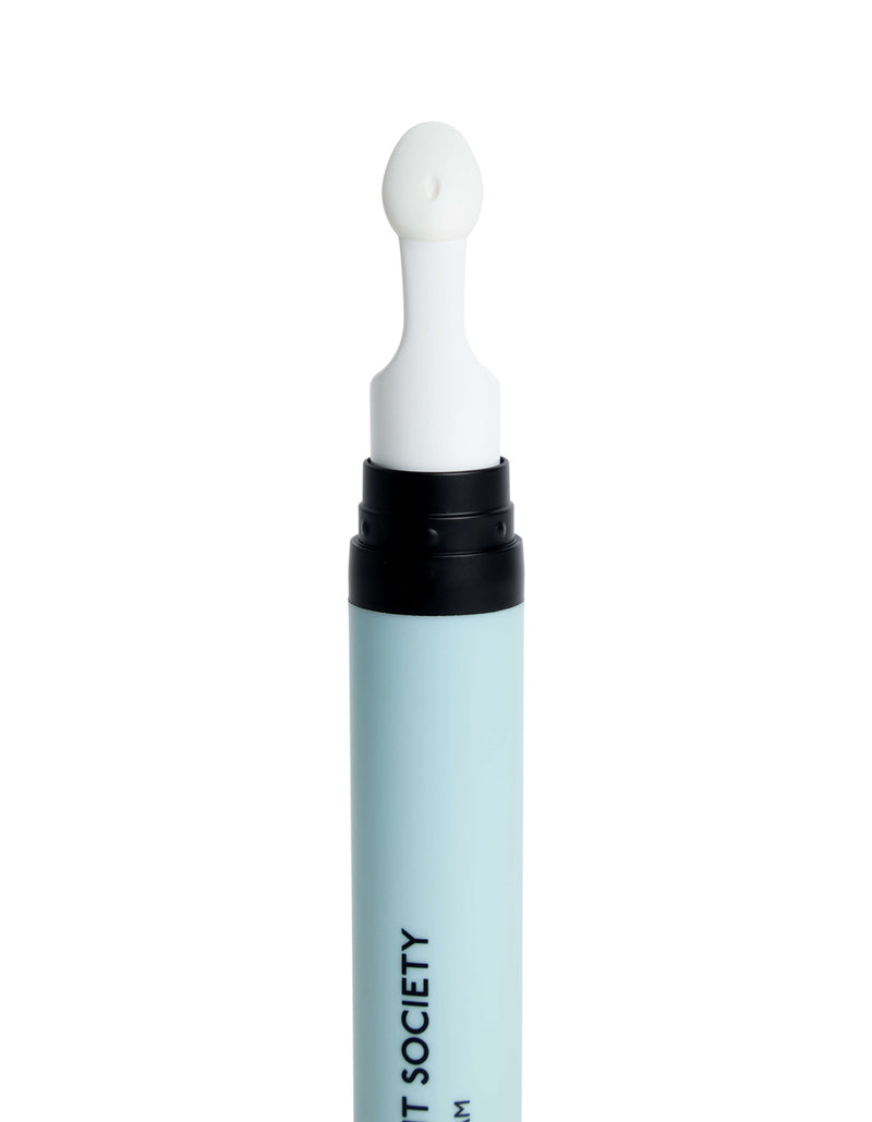 A light blue tube of Cozy Earth's Eye Cream features a black twist top and a white, rounded applicator attached at the top. Partial black text runs along the side of the tube.