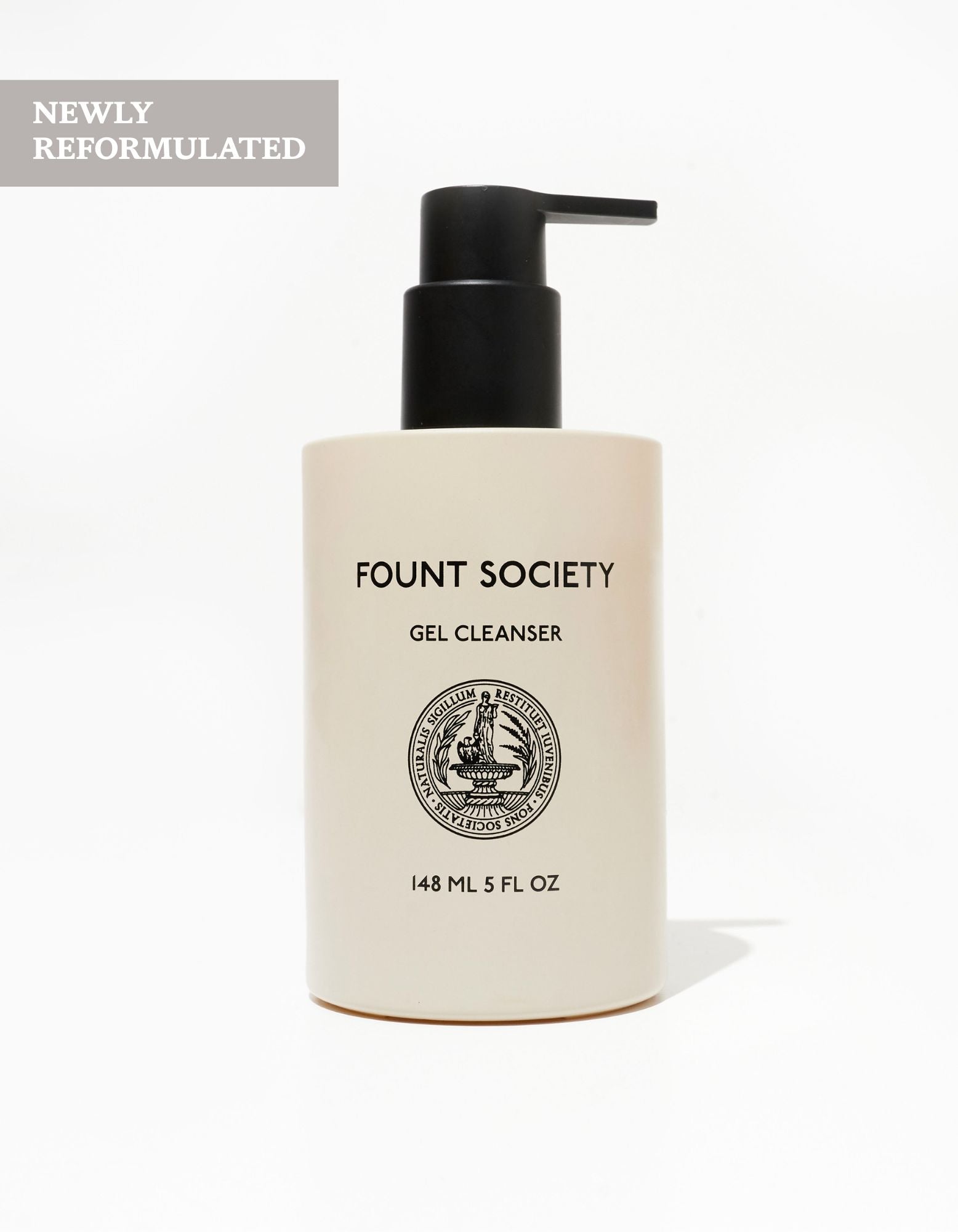 A beige bottle of Cozy Earth Gel Cleanser with a black pump, 148 ml (5 fl oz). The label shows a circular emblem, with “NEWLY REFORMULATED” in a gray box at the top left corner.