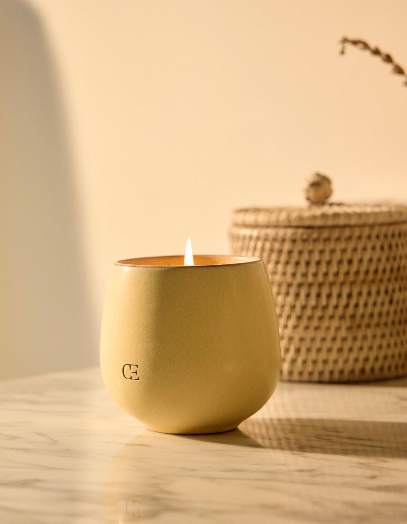 The Candle ISLE by Cozy Earth is a candle in a container.