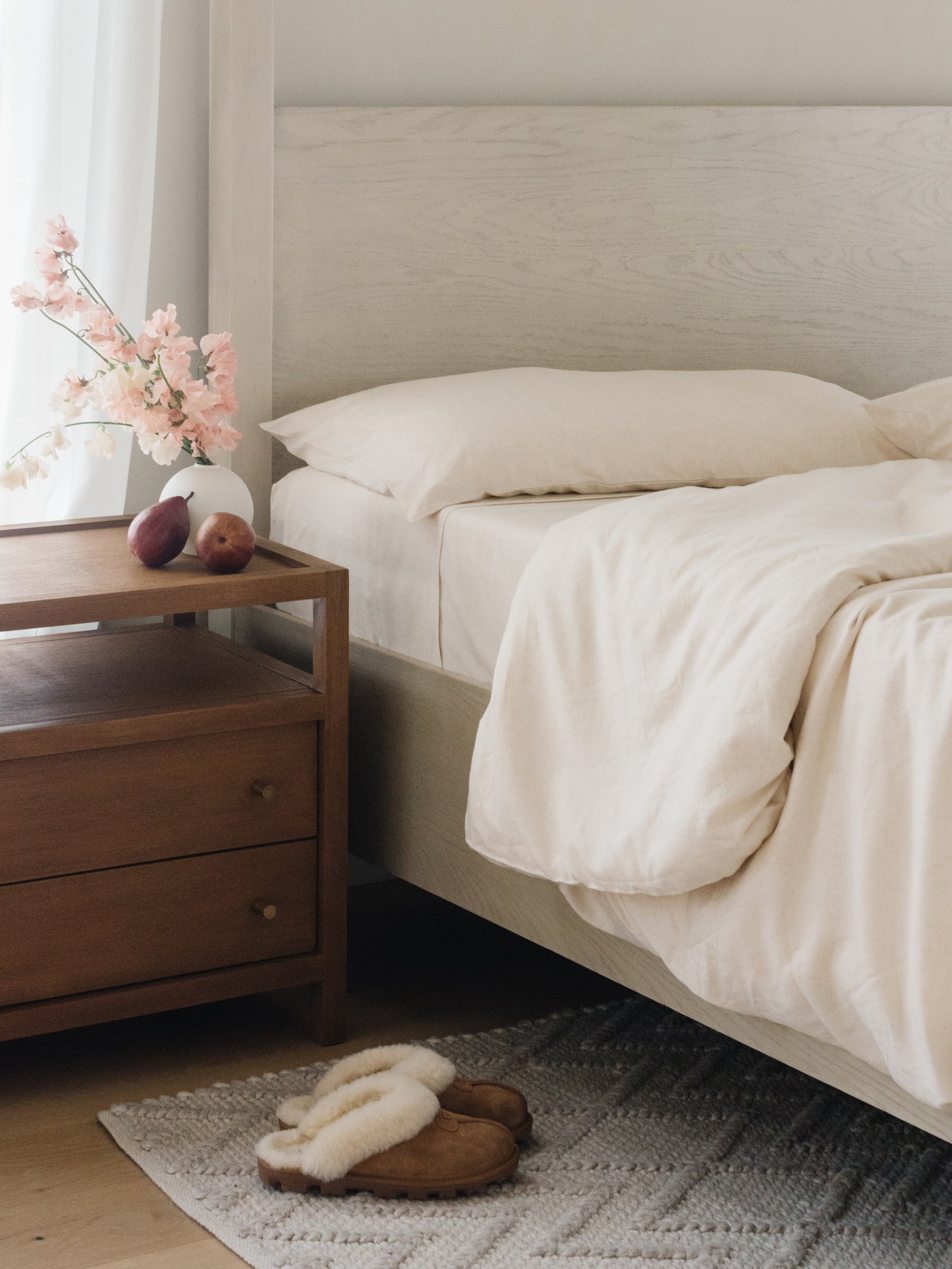 Natural Bamboo Linen Sheet Set on a mattress and bed frame. 