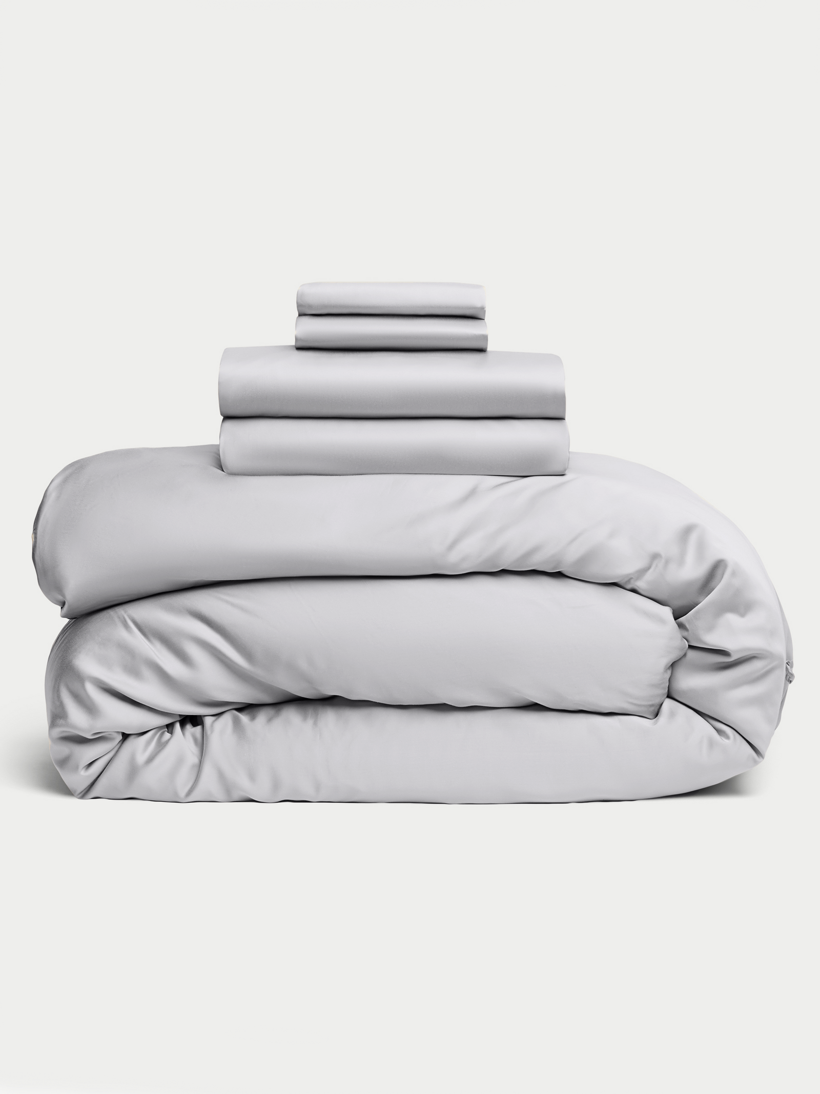 Light Grey bedding bundle stacked up with white background 