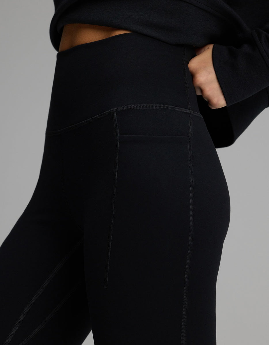 Close-up of black high-waisted Women’s Liv Leggings with Pockets featuring a side pocket and visible seam detailing.
