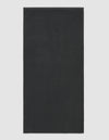 The Cozy Earth Loop Terry Bath Mat is rectangular and solid dark gray with a soft, uniform texture, shown against a plain light background.|Color:Graphite
