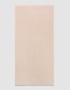The Cozy Earth Loop Terry Bath Mat, a rectangular bath mat in light beige with a soft, plush texture, is displayed against a plain white background.|Color:Petal