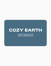 A blue rectangular Monthly membership card with the text “COZY EARTH MEMBER” printed in white.