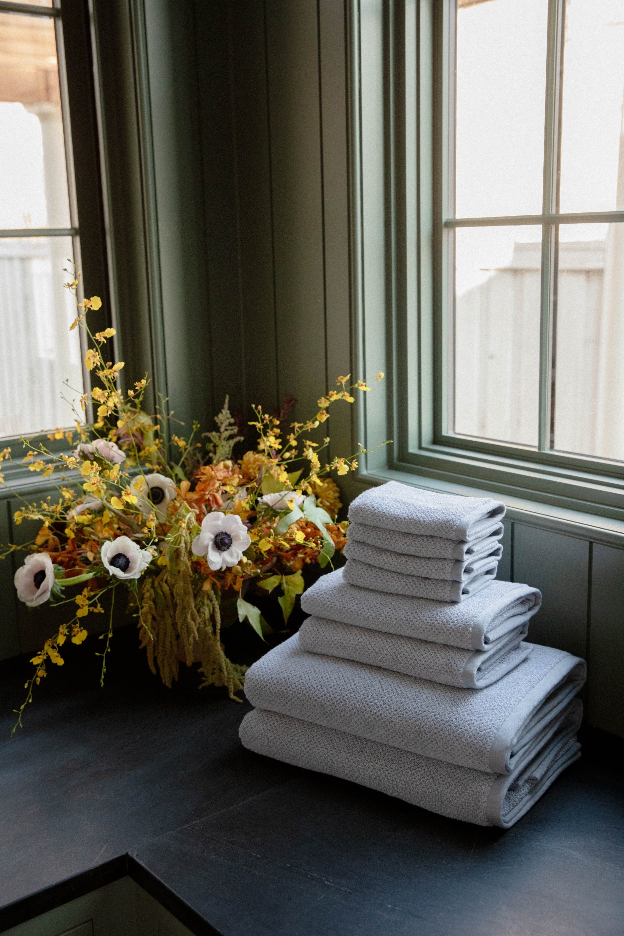 Nantucket Bath Towel Set in the color Heathered Harbor Mist. Photo of Nantucket Bath Towel Set taken with the Heathered Harbor Mist Bundle resting on a bathroom countertop. |Color:Heathered Harbor Mist