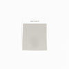 A "Bamboo Sheet Swatch" from Cozy Earth, featuring a light gray fabric with a smooth texture and a zigzag edge, displayed against a white background. |Color:Light Grey
