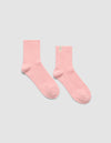 A pair of The Plush Modern Crew Sock in pink by Cozy Earth.|Color:Tulip