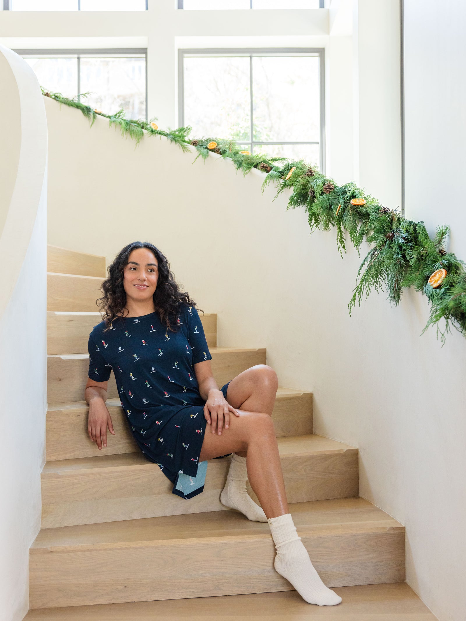 Woman sits on stairs wearing Women's Bamboo Stretch Knit Sleep Dress in Ski Navy 