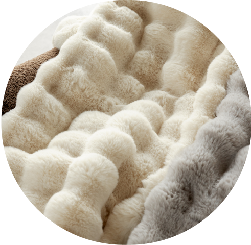 A close-up of the Cozy Earth Bubble Cuddle Blankets in two colors