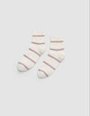 The Women's Sadie Sock by Cozy Earth is a pair of white ankle socks featuring light purple horizontal stripes and ribbed cuffs, displayed flat on a light gray background. |Color:Parchment/Dusty Orchid