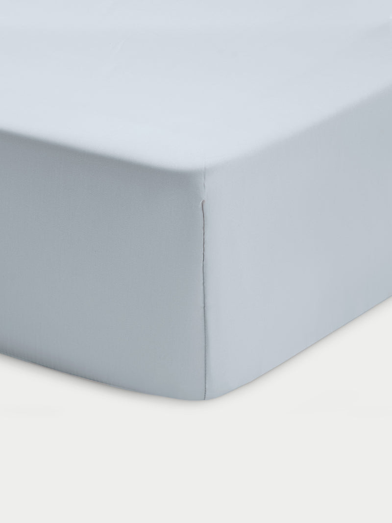 Corner of shore crib sheet with white background