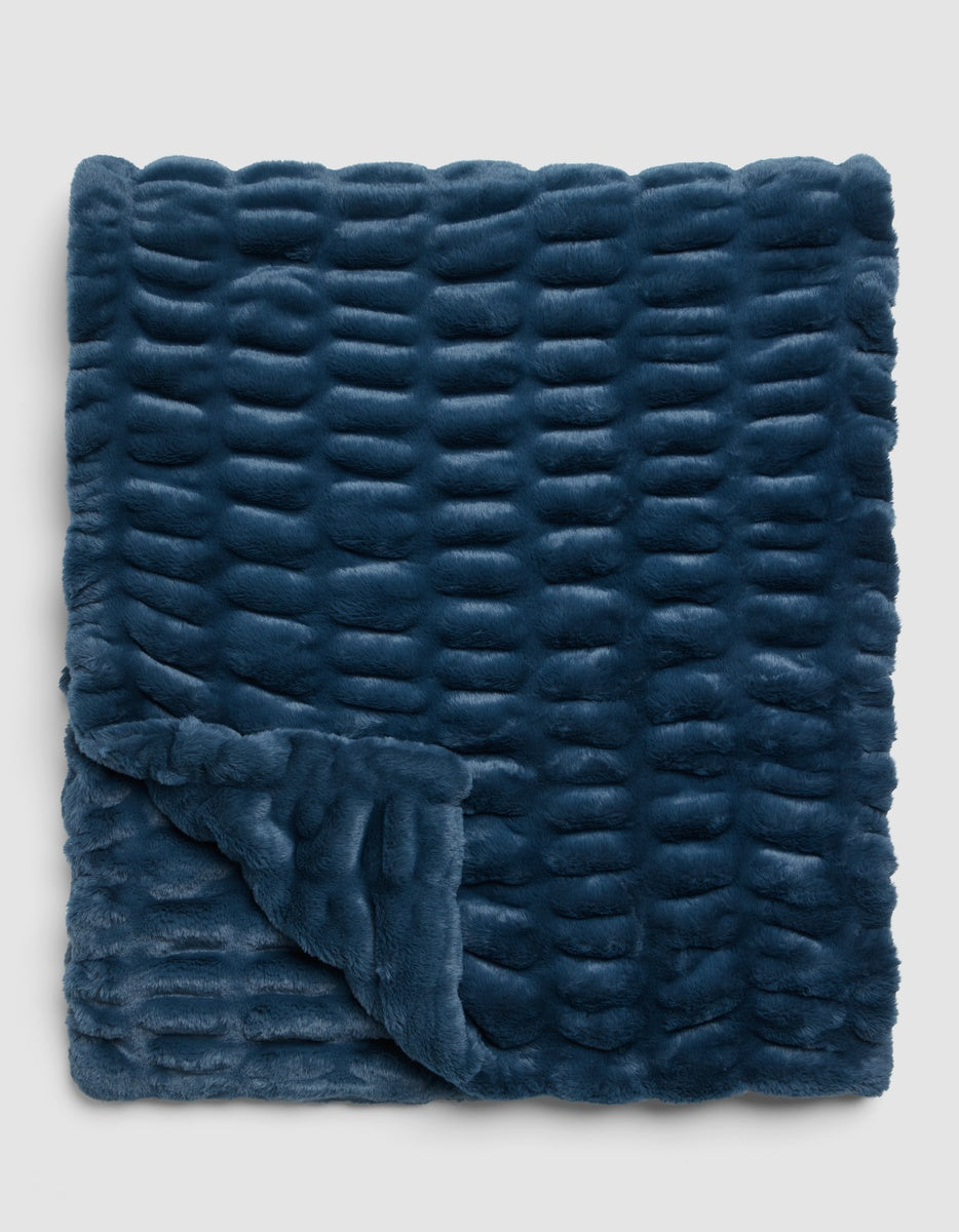 Deep blue Cozy Earth Snuggle Cuddle Blanket with a textured, repeating horizontal ribbed pattern.