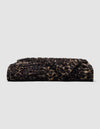 Folded Snuggle Cuddle Blanket in a brown and black leopard print pattern.|Color:Leopard in Sandalwood/Black