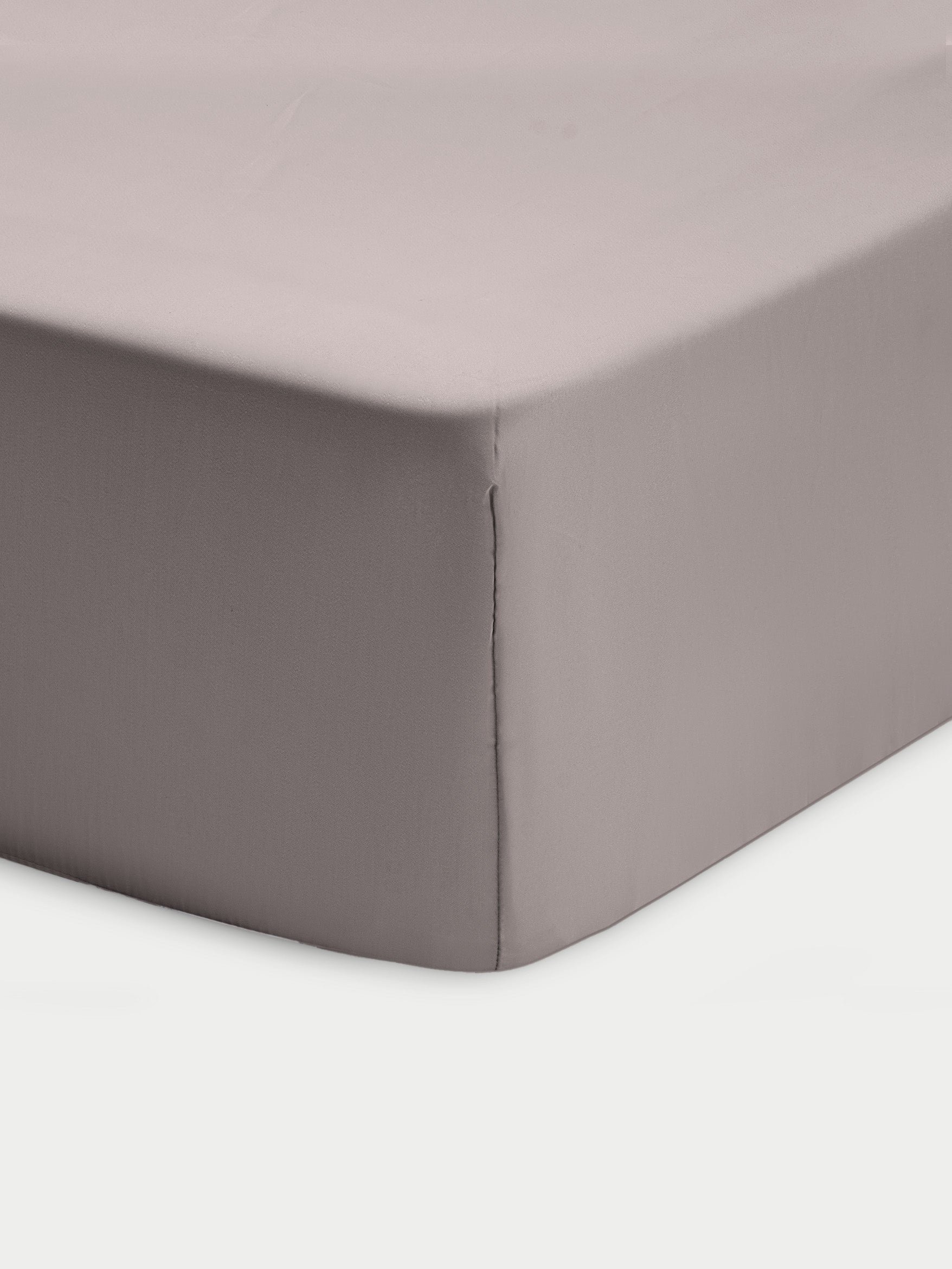Corner of stone crib sheet with white background 