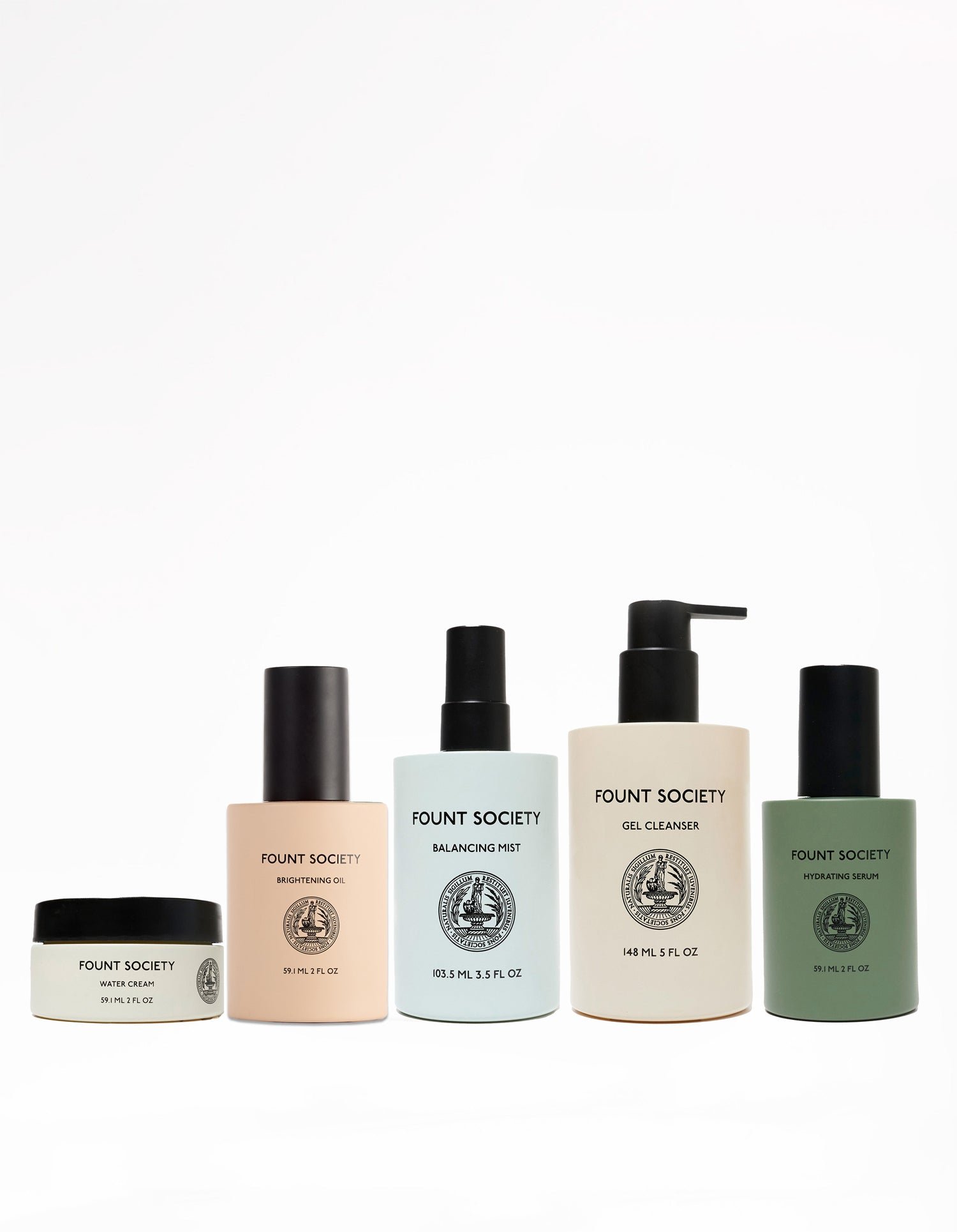 A row of five Cozy Earth products from "The Routine" collection, neatly arranged from left to right: a night cream jar, a cylindrical moisturizer bottle, a balancing mist spray bottle, a gel cleanser with pump, and a hydrating serum.