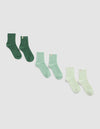 Three pairs of Cozy Earth’s The Plush Modern Crew Socks in green shades, arranged diagonally from dark on the left to light on the right, displayed against a plain light background.|Color:Jade/Wintergreen/Pistachio Cream