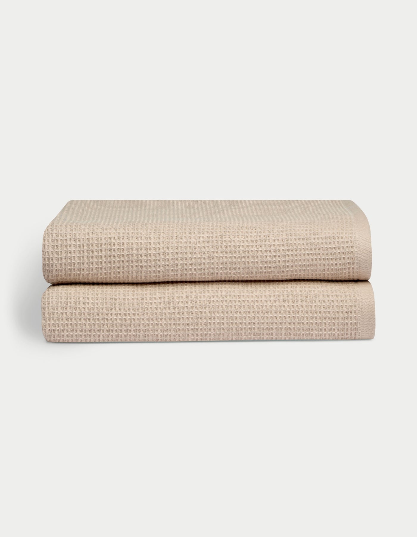 Waffle Bath Sheets in the color sand. Photo of Waffle Bath Sheets taken with white a background. 