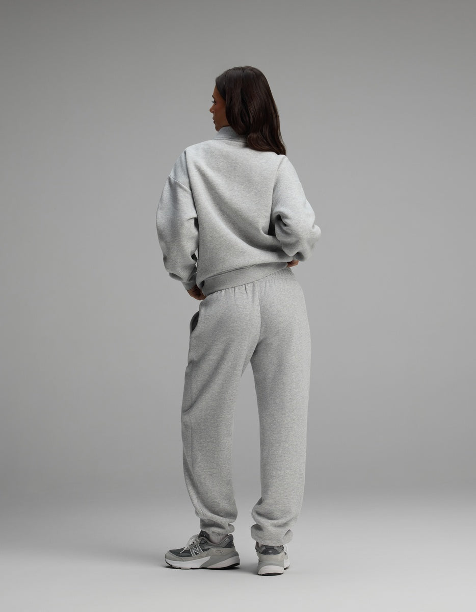 A person seen from behind, wearing the grey Women’s Cityscape Quarter Zip & Sweatpant Set by Cozy Earth.