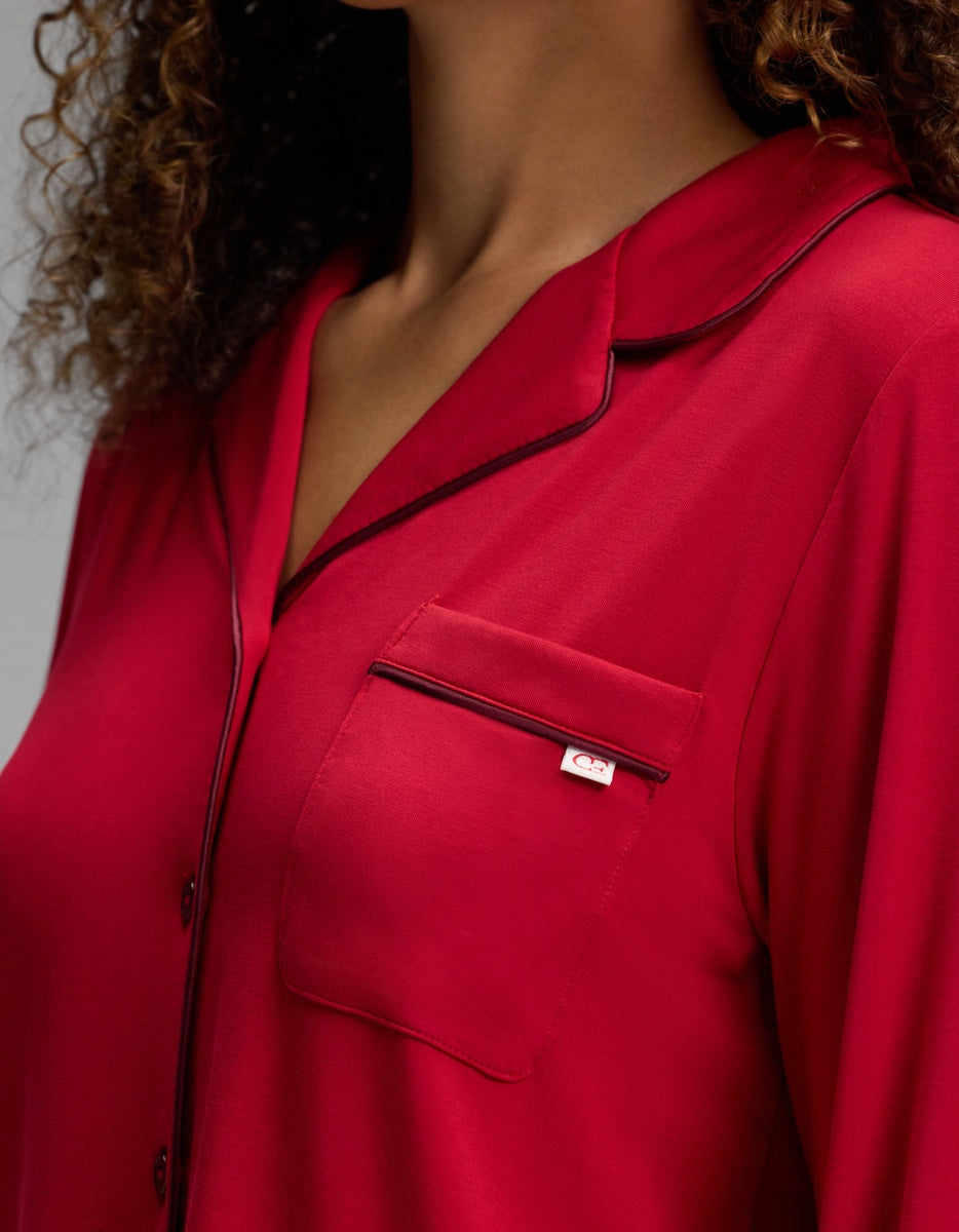 Cozy Earth Women’s Bamboo Stretch-Knit Long Sleeve Pajama Top in red with a notched collar, chest pocket, and dark piping.