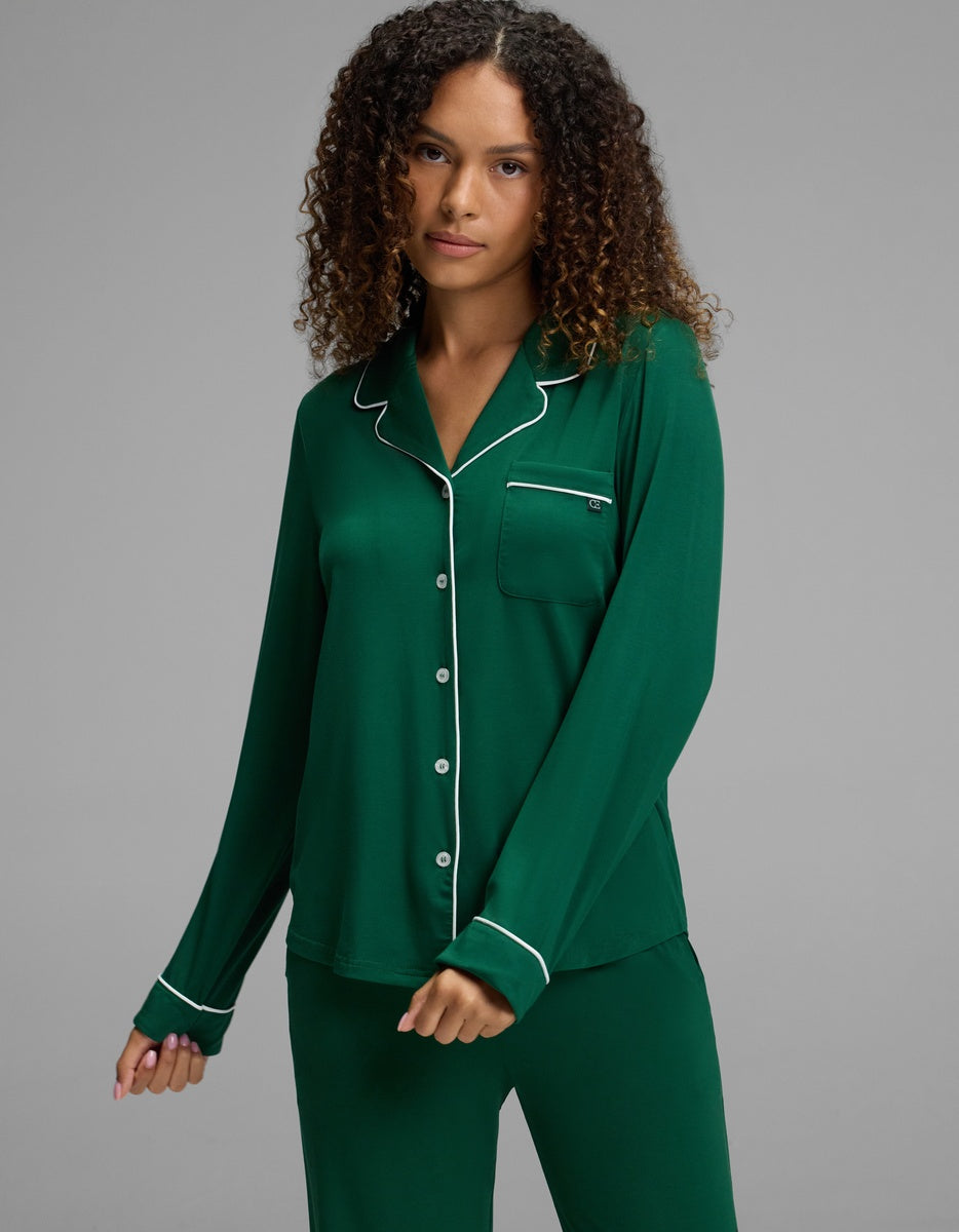 Cozy Earth Women’s Bamboo Stretch-Knit Long Sleeve Pajama Top in dark green with white piping and a chest pocket.