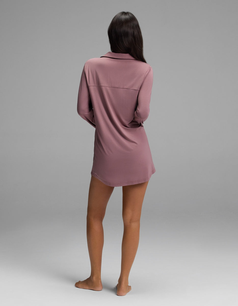 A person viewed from behind wearing a mauve long-sleeved Cozy Earth Women’s Bamboo Stretch-Knit Long Sleeve Sleep Dress.|Color:Copper Rose