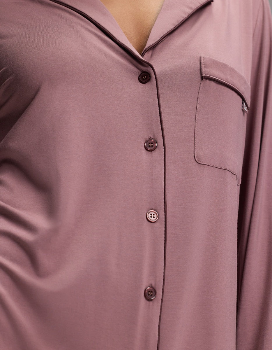 Close-up of a dusty rose Women’s Bamboo Stretch-Knit Long Sleeve Sleep Dress featuring a collared neckline, long sleeves, and a single chest pocket.