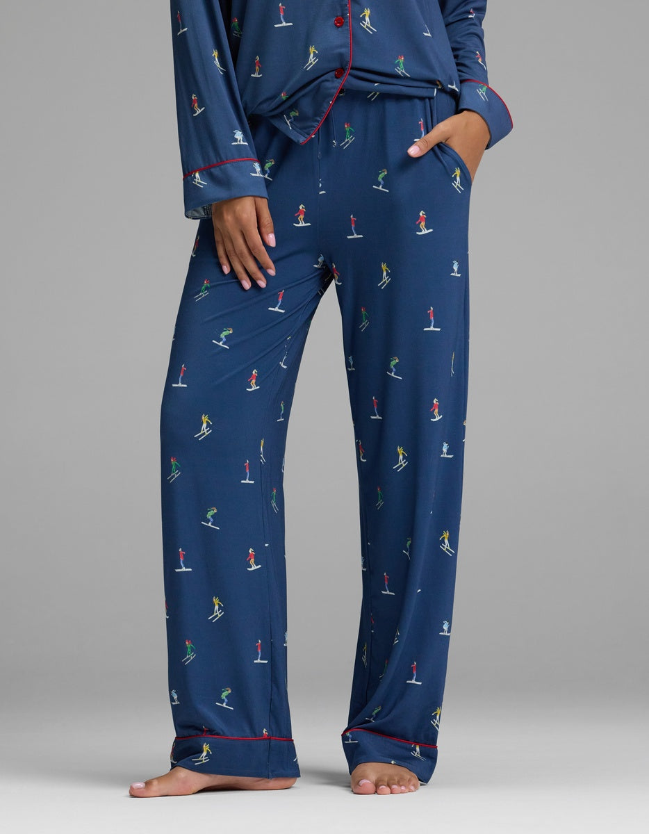 Cozy Earth Women’s Bamboo Stretch-Knit Pajama Pant in navy blue with a repeating pattern of colorful skiers.