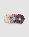 Three Cozy Earth Bamboo Stretch-Knit Scrunchies in shades of cream, mauve, and plum arranged in a row.|Color:Copper Rose/Lilac/Sea Salt