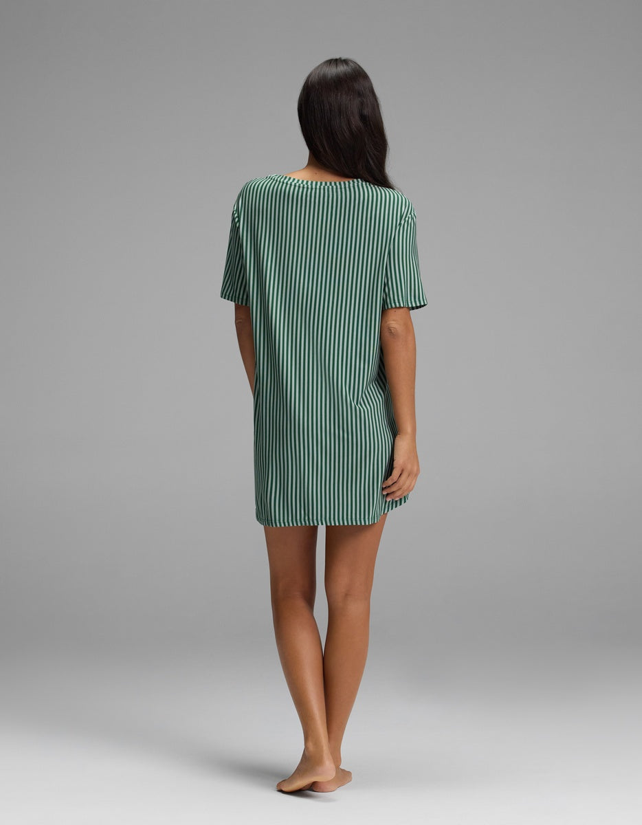 Back view of a person wearing a green and dark navy vertically striped Cozy Earth Women’s Bamboo Stretch-Knit Sleep Dress.