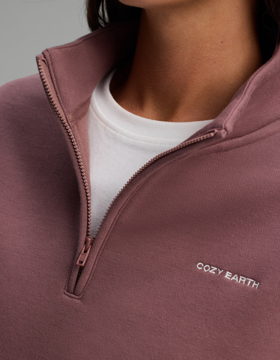 Cozy Earth Women’s CityScape Quarter Zip in dusty mauve with a high collar and zipper, worn over a white shirt.